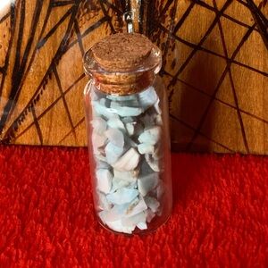 BOGO1/2 TURQUOISE TUMBLED CHIPS IN SMALL GLASS BOTTLE